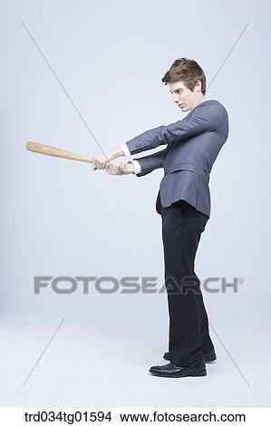 A man swing the bat View Large Photo Image Picture - A man swing the bat. Fotosearch