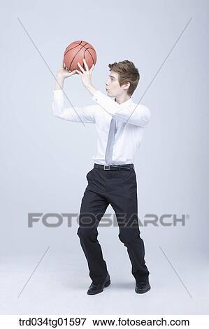A man throwing the basket ball View Large Photo Image Stock Photo - A man throwing the basket ball. Fotosearch