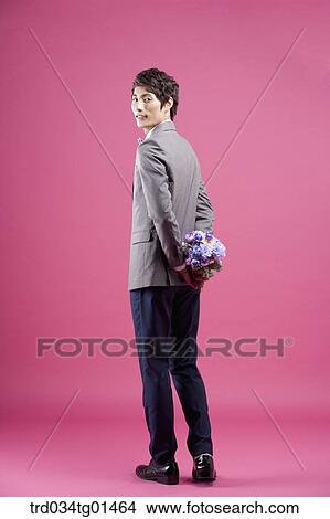 A man wearing formal suit with the flower View Large Photo Image Picture - A man wearing formal suit with the flower. Fotosearch