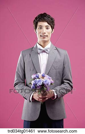 A man wearing formal suit with the flower View Large Photo Image Stock Image - A man wearing formal suit with the flower. Fotosearch