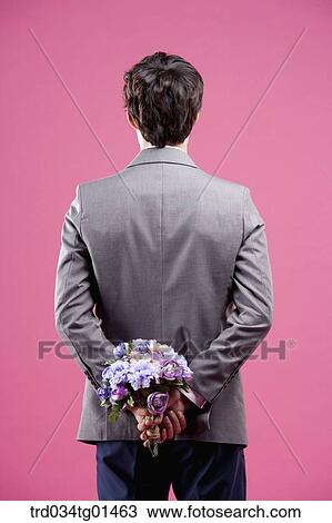 A man wearing formal suit with the flower View Large Photo Image Stock Image - A man wearing formal suit with the flower. Fotosearch