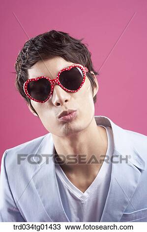 A man wearing the heart shaped glasses View Large Photo Image Stock Image - A man wearing the heart shaped glasses. Fotosearch