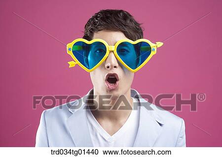 A man wearing the heart shaped glasses View Large Photo Image Stock Image - A man wearing the heart shaped glasses. Fotosearch