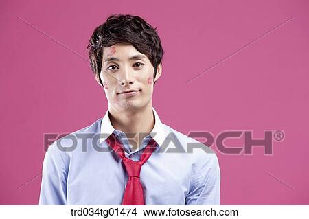 A man with red lip print on his cheeks View Large Photo Image Picture - A man with red lip print on his cheeks. Fotosearch