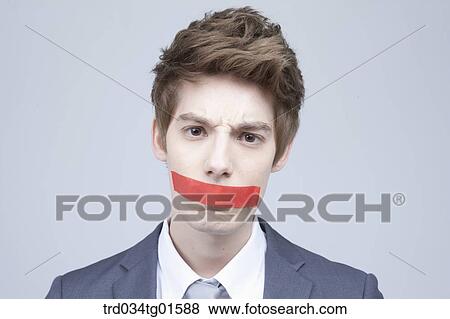 A man with red tape on his mouth View Large Photo Image Stock Photo - A man with red tape on his mouth. Fotosearch