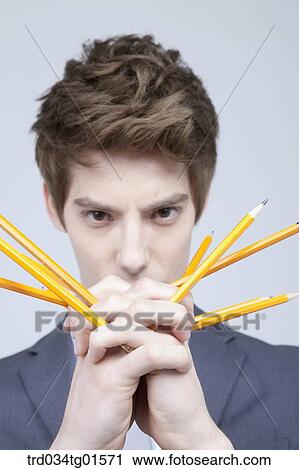 A man with the pencils in his hand View Large Photo Image Stock Image - A man with the pencils in his hand. Fotosearch