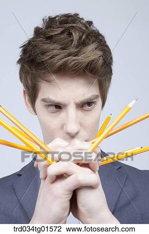 A man with the pencils in his hand View Large Photo Image Stock Image - A man with the pencils in his hand. Fotosearch