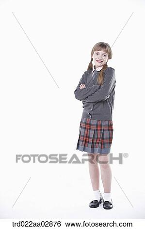 A standing American student with her arms folded View Large Photo Image Stock Photograph - A standing American student with her arms folded. Fotosearch