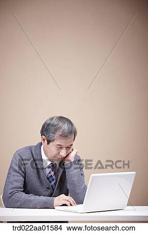 Picture - A stressful old man with laptop . Fotosearch
