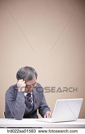 A stressful old man with laptop View Large Photo Image Stock Image - A stressful old man with laptop . Fotosearch