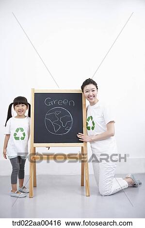 A woman and girl with green globe painting View Large Photo Image Stock Photograph - A woman and girl with green globe painting . Fotosearch