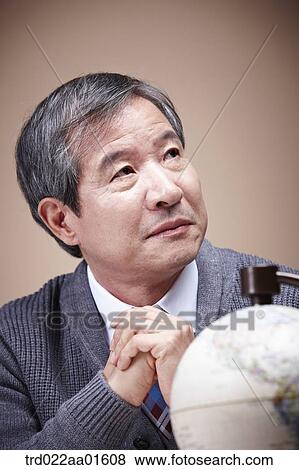 A worrying old man with the globe View Large Photo Image Stock Photo - A worrying old man with the globe. Fotosearch