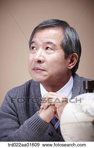 A worrying old man with the globe View Large Photo Image Stock Photo - A worrying old man with the globe. Fotosearch