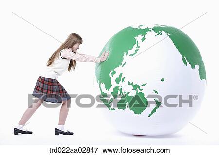 An American student pushing the globe View Large Photo Image Stock Photo - An American student pushing the globe. Fotosearch