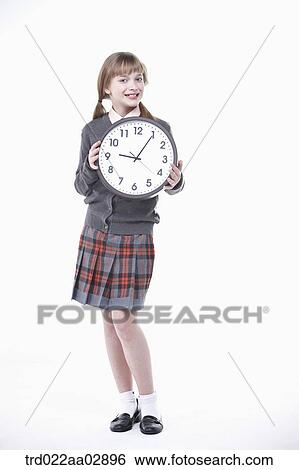 An American student with clock View Large Photo Image Stock Photograph - An American student with clock. Fotosearch
