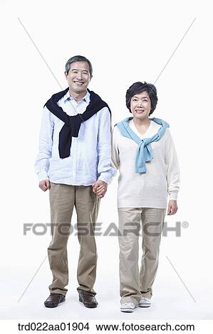 An old couple holding hands together View Large Photo Image Picture - An old couple holding hands together. Fotosearch