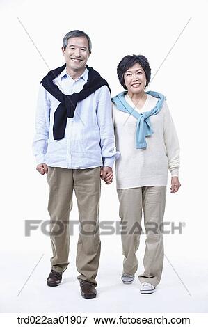 An old couple holding hands together View Large Photo Image Stock Photo - An old couple holding hands together. Fotosearch