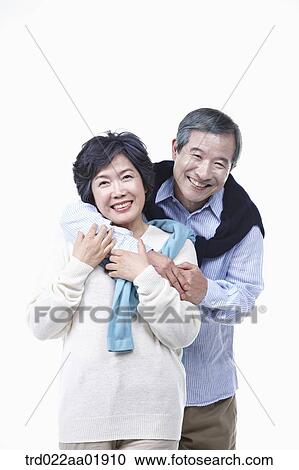 An old couple hugging each other View Large Photo Image Stock Image - An old couple hugging each other. Fotosearch