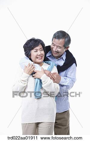 An old couple hugging each other View Large Photo Image Stock Image - An old couple hugging each other. Fotosearch