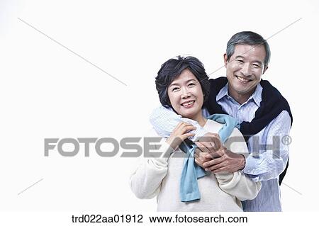 An old couple hugging each other View Large Photo Image Stock Image - An old couple hugging each other. Fotosearch