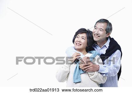 An old couple hugging each other View Large Photo Image Stock Image - An old couple hugging each other. Fotosearch