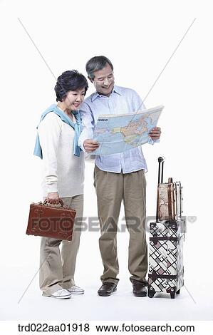 An old couple looking at map View Large Photo Image Stock Photo - An old couple looking at map . Fotosearch