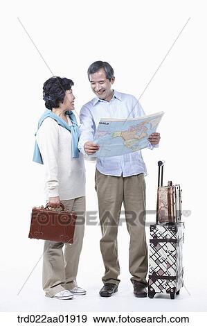 An old couple looking at map View Large Photo Image Stock Photo - An old couple looking at map . Fotosearch