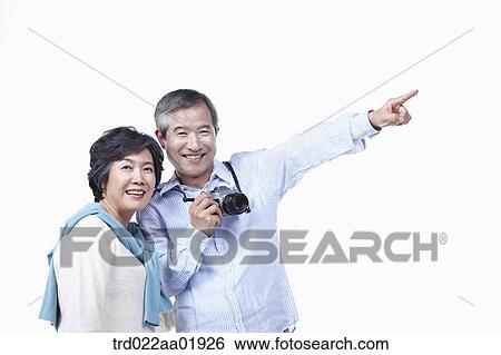 An old couple photographing with camera View Large Photo Image Stock Photograph - An old couple photographing with camera. Fotosearch