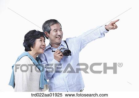 An old couple photographing with camera View Large Photo Image Stock Photography - An old couple photographing with camera. Fotosearch
