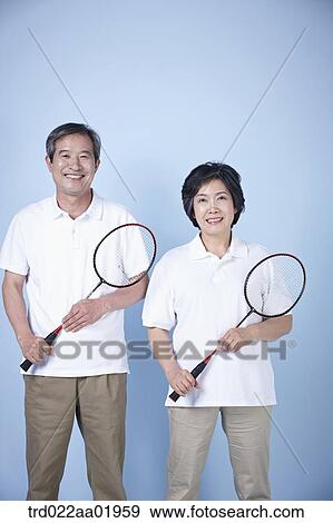 An old couple with badminton racket View Large Photo Image Stock Photo - An old couple with badminton racket. Fotosearch