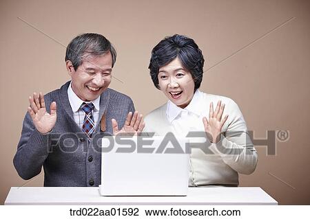 An old man and old woman surprised at laptop monitor View Large Photo Image Stock Image - An old man and old woman surprised at laptop monitor. Fotosearch