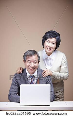 An old man and old woman with laptop View Large Photo Image Stock Photography - An old man and old woman with laptop . Fotosearch