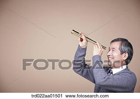 An old man looking through telescope View Large Photo Image Stock Image - An old man looking through telescope. Fotosearch