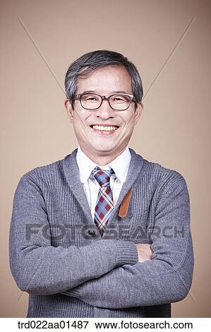An old man with his arms folded View Large Photo Image Stock Photo - An old man with his arms folded. Fotosearch