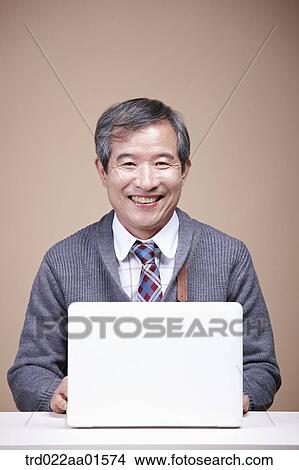 An old man with laptop View Large Photo Image Picture - An old man with laptop . Fotosearch