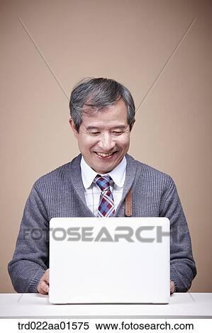 An old man with laptop View Large Photo Image Stock Photography - An old man with laptop . Fotosearch