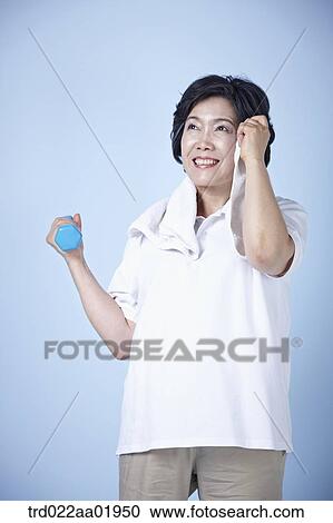 An old woman exercising with dumbbell View Large Photo Image Stock Image - An old woman exercising with dumbbell . Fotosearch