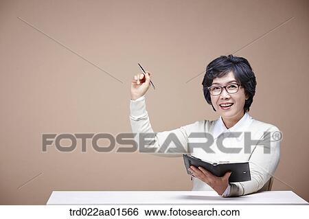 An old woman holding the pen and planner View Large Photo Image Stock Photograph - An old woman holding the pen and planner. Fotosearch