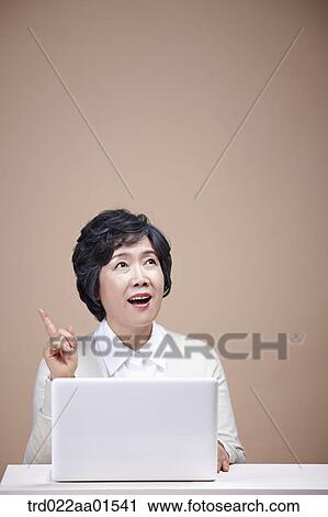 An old woman thinking of idea with laptop View Large Photo Image Stock Image - An old woman thinking of idea with laptop. Fotosearch
