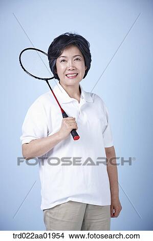 An old woman with badminton racket View Large Photo Image Picture - An old woman with badminton racket . Fotosearch