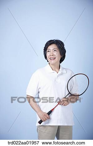 An old woman with badminton racket View Large Photo Image Stock Photo - An old woman with badminton racket . Fotosearch
