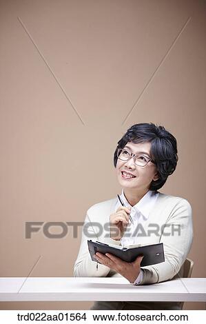 An old woman with planner View Large Photo Image Picture - An old woman with planner. Fotosearch