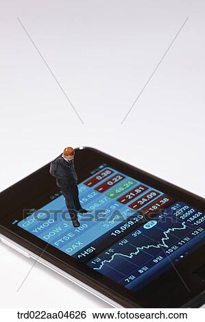 Stock Photograph - Businessman figure on the Smartphone . Fotosearch