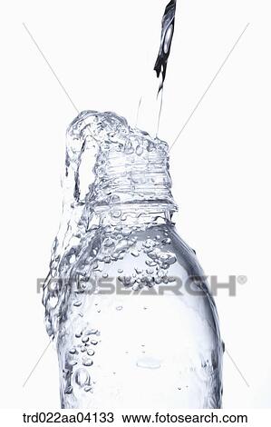Filling the bottle with water View Large Photo Image Stock Image - Filling the bottle with water. Fotosearch