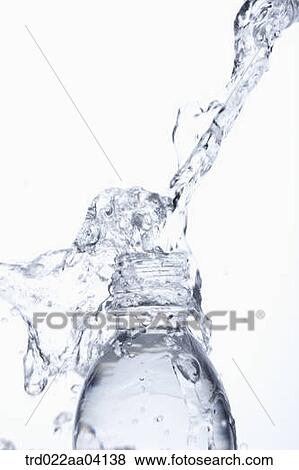 Stock Photo - Filling the bottle with water. Fotosearch