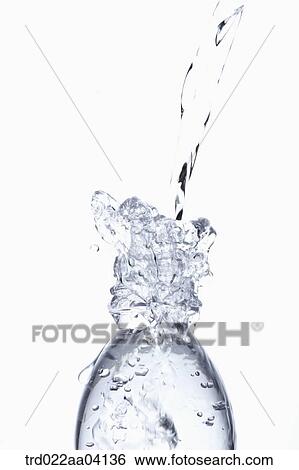 Stock Photograph - Filling the bottle with water. Fotosearch