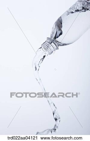 Pouring water from the bottle View Large Photo Image Stock Image - Pouring water from the bottle. Fotosearch