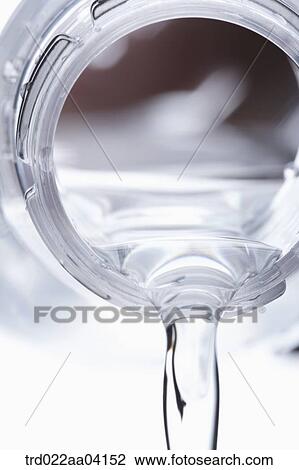Stock Image - Pouring water from the bottle. Fotosearch