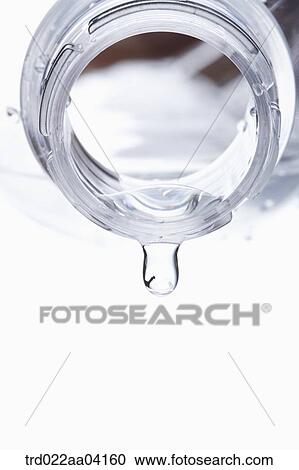Stock Image - Pouring water from the bottle. Fotosearch