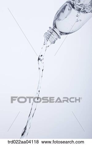 Pouring water from the bottle View Large Photo Image Stock Photo - Pouring water from the bottle. Fotosearch